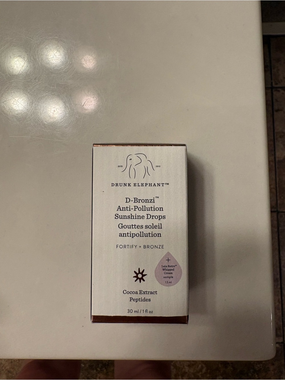 Drunk Elephant D-Bronzi Sunshine Drops — White Box with Bronze Accents